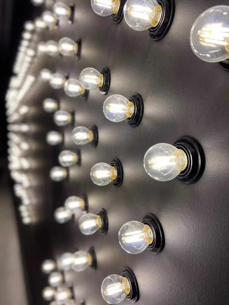 clear lit bulbs on black surface